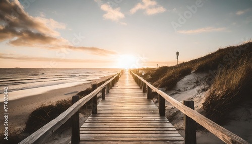 empty wooden walkway on the ocean coast in the sunset time pathway to beach