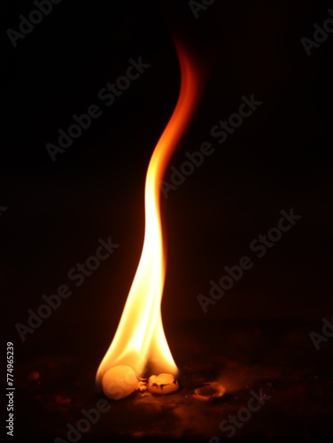 Vertical shot of the camphor burning