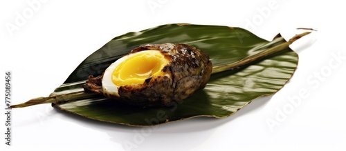 Khai pam is grill egg in banana leave. You can find in street food