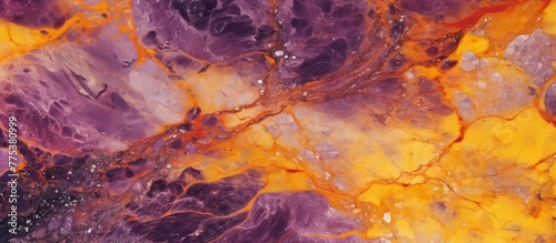 This image features a close-up of a vibrant purple and yellow marble set against a dark black background, showcasing its intricate details and colors