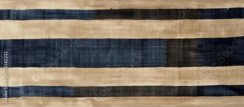 A close up of a piece of cloth with a black and white stripe