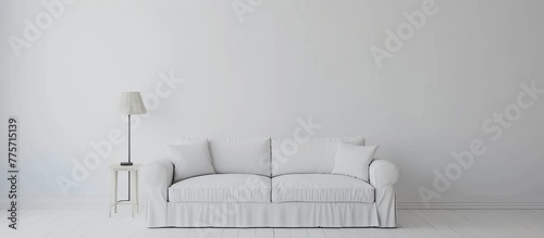 White couch in a room with a lamp
