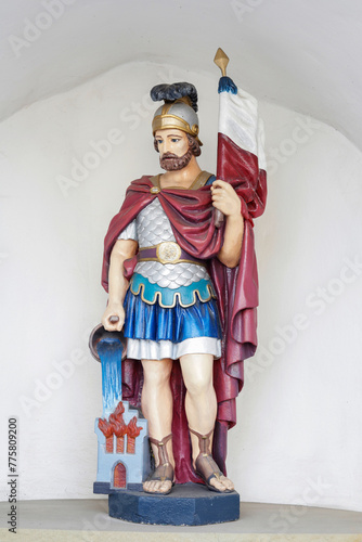 CZARNY DUNAJEC, POLAND - MARCH 29, 2024: Figure of Saint Florian at the church in Czarny Dunajec, Poland.