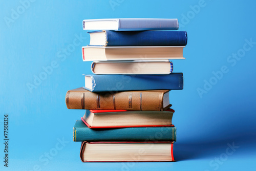 books on a blue plain background. Knowledge day, back to school