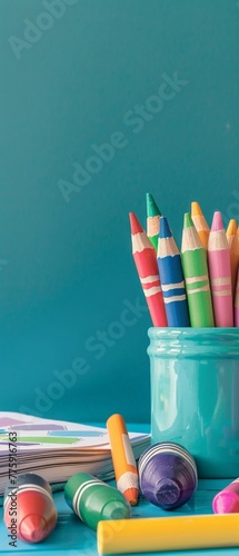 A simple, vibrant image of crayons and a coloring book on a desk, symbolizing early learning