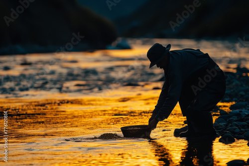 Prospector Panning for Gold at Dusk