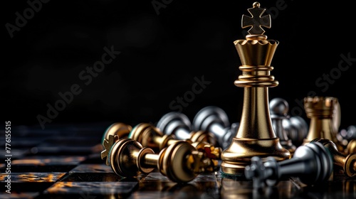 golden chess king standing on a board among fallen chess pieces on a black background