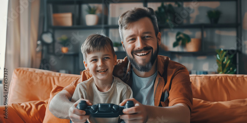 Young father playing video games with his child. Good parenting, bonding, quality time with a child, fun active leisure for families with kids. Celebration of Father's Day concept.