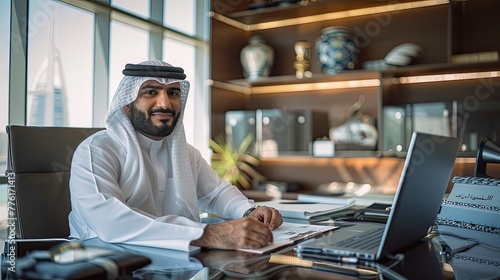 Kwaiti businessman sitting on the chair inside a luxurious office.