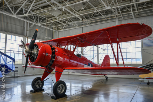 Vintage Aviation: Classic Red Biplane in an Aircraft Hangar