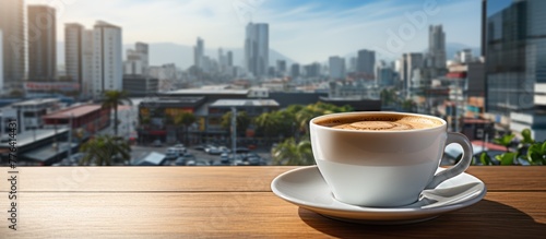 White cup of coffee on table in outdoors cafe with blurred city street background, Morning coffe
