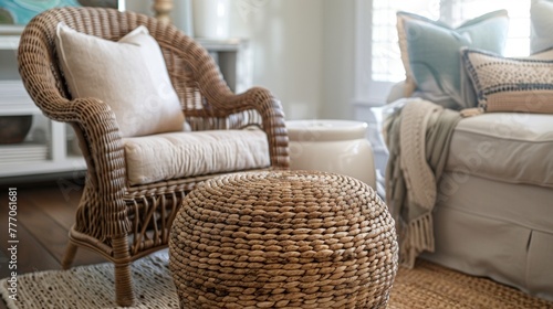 The furnishings in the room are a mix of natural materials with a comfortable wicker chair and bamboo side table. A large sisal ottoman serves as a coffee table offering extra storage .