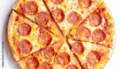 Pepperoni pizza cut into slices, top view, full frame.
