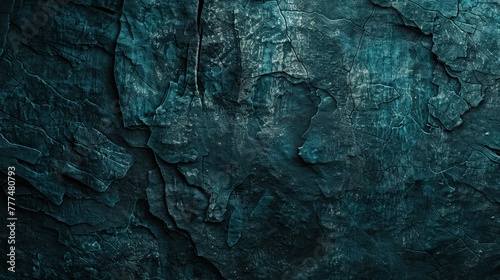 A dark teal rocky surface resembling an ancient, eroded wall. The texture is deeply grooved and weathered, giving it a historical feel.