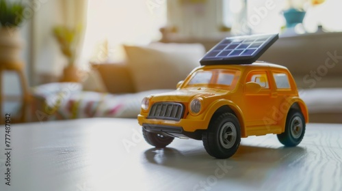 Eco-friendly toy car with solar panel on roof indoors, concept of renewable energy