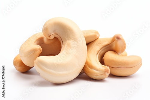 cashews. a bunch of peeled nuts on a white background. a healthy vegan product.