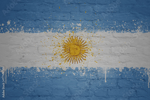 painted big national flag of argentina on a massive old brick wall