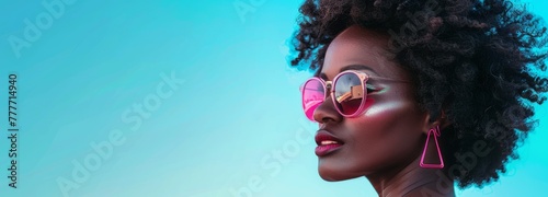 A stylish image capturing a side profile of a woman with vibrant pink neon hoop earrings and a beautiful afro hairstyle