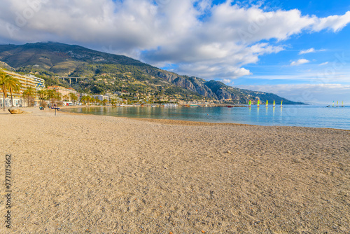 View from the plage des Sablettes beach at Menton, France, looking towards the Italian border and the Garavan port district and town of Ventimiglia, Italy.