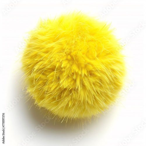 Vibrant yellow, fluffy object against a white background, resembling a soft pom-pom or textile material