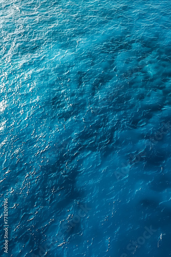 Sea surface. Aerial view of blue clean sea. Vertical summer background. Copy space.