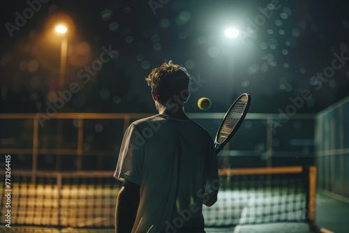Tennis Player Under Night Lights