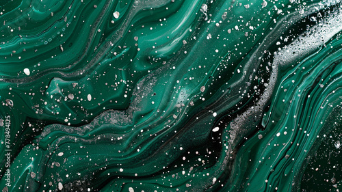 A vivid, liquid abstract marble painting background with a deep emerald green base and sparkling silver glitter splatter texture
