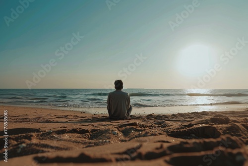 A person having depression episode, alone by the beach