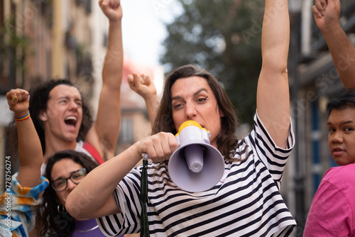 Transgender woman screaming during a protest to support LGBTQ community. Horizontal