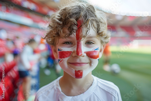 child boy soccer fun with painted face of flag England in football stadium child boy soccer fun with painted face of flag England in football stadium 