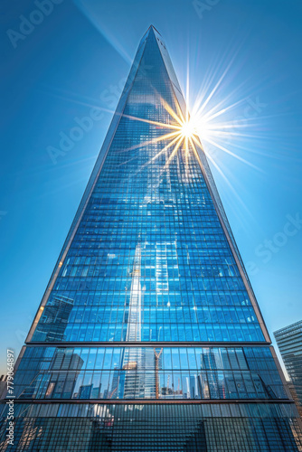 A modern skyscraper, shot from a low angle to emphasize its height and grandeur
