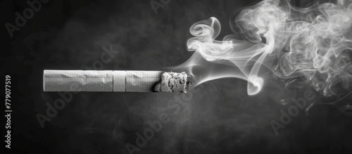 A black and white composition capturing a lit cigarette with smoke billowing out of it.