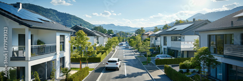 A picturesque scene of a row of charming houses lining a street with majestic mountains towering in the background