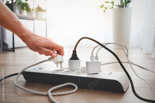 Power strip socket with connected plugs.