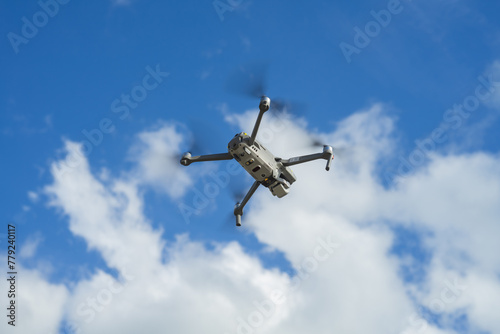 An unmanned aerial vehicle or quadcopter drone that flies with four rotors