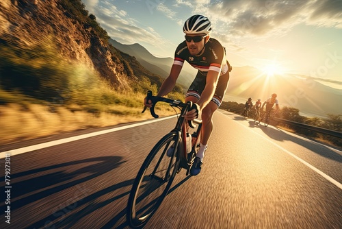 Cyclist racing at sunset on a mountain road