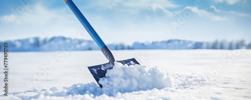 Shovel in the snow, amazing blurred background