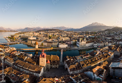 Lucerne, Switzerland: Panoramic view of the Lucerne medieval old town along the Reuss river with the famous Chapel bridge and Mt Pilatus mountain