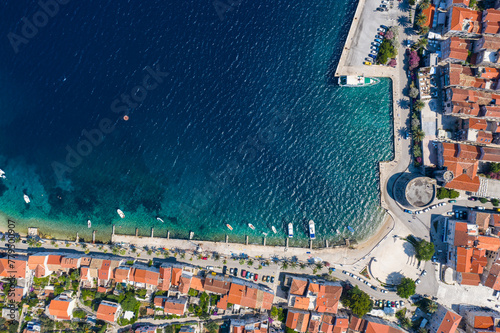 Korcula, Croatia: Top down drone view of the famous Korcula old town and pier by the Adriatic sea in Croatia