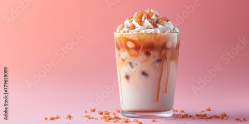 Iced caramel latte, macchiato, coffee with whipped cream and caramel syrup in glass with ice cubes on pastel pink background, copy space