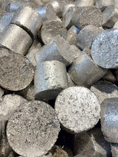 Briquettes of compressed Aluminium swarf ready to be re-melted