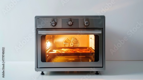 Modern compact high-efficiency toaster oven baking pizza on kitchen countertop