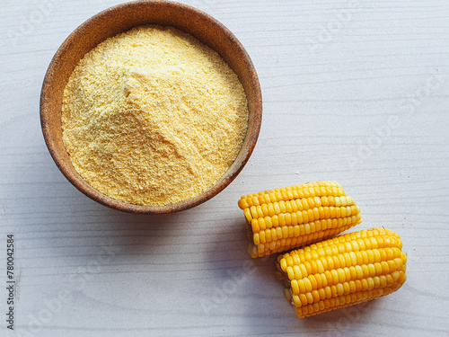 cornmeal in bowl and light background