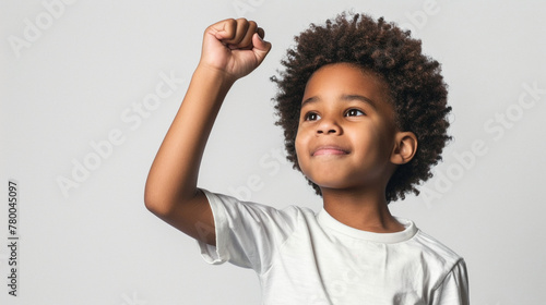 Kid fist upward on neutral background. african american black afro child raise hand.