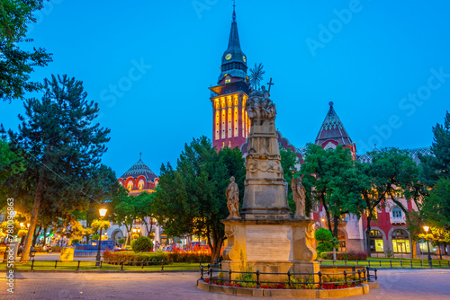 Sunset view of the holy trinity monument and Art nouveau town ha