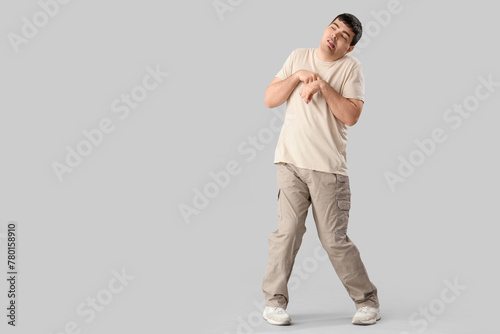 Young man on light background. National Cerebral Palsy Awareness Month