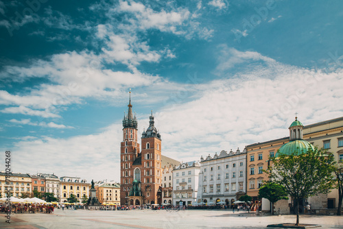 Krakow, Poland. St. Mary's Basilica And Cloth Hall Building. Famous Old Landmark Church Of Our Lady Assumed Into Heaven. Saint Mary's Church In Of The Main Market Square. UNESCO World Heritage Site