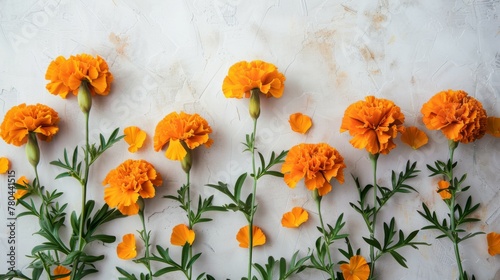 Orange marigold flowers with vibrant petals and green stems in a natural blossom arrangement