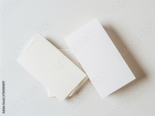 Mockup of Blank empty white cards on a white background, ideal for mockup design like poster, notepad, invitation card, presentation, business card, brochure