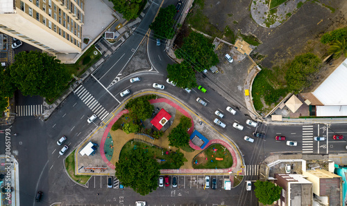 Small square with parking and cars passing around